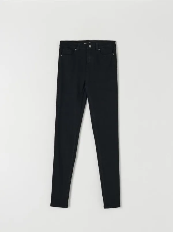 Spodnie jeansowe o kroju skinny, uszyte z bawełny z domieszką elastycznych włókien. - czarny