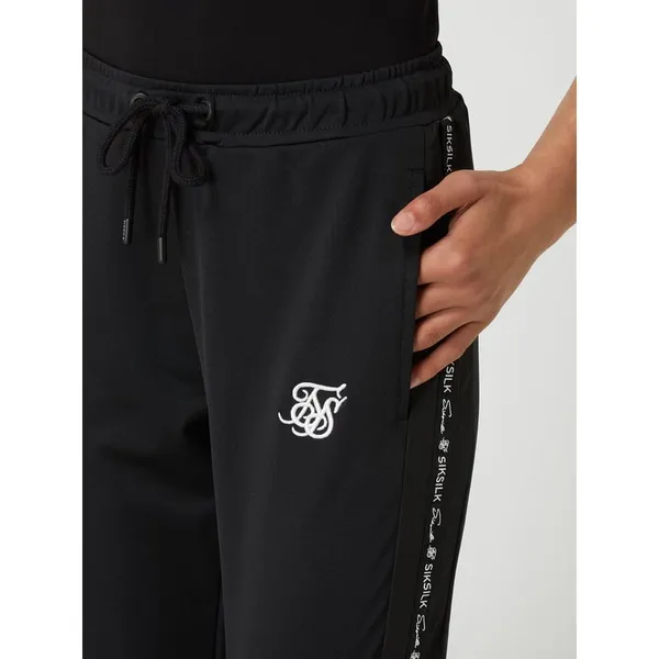 SIK SILK Spodnie typu track pants z detalami z logo