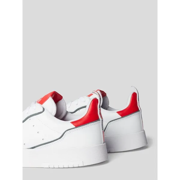 adidas Originals Sneakersy z detalami z logo model ‘Supercourt’