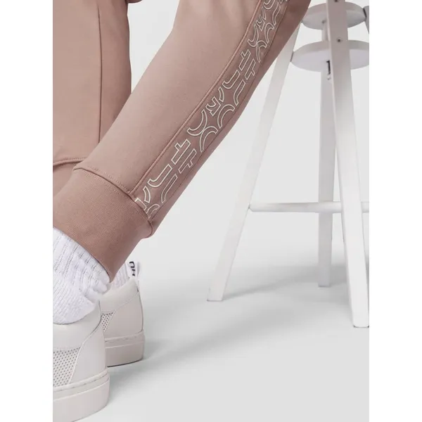 HUGO Spodnie dresowe o kroju slim fit z nadrukiem z logo model ‘Daky’