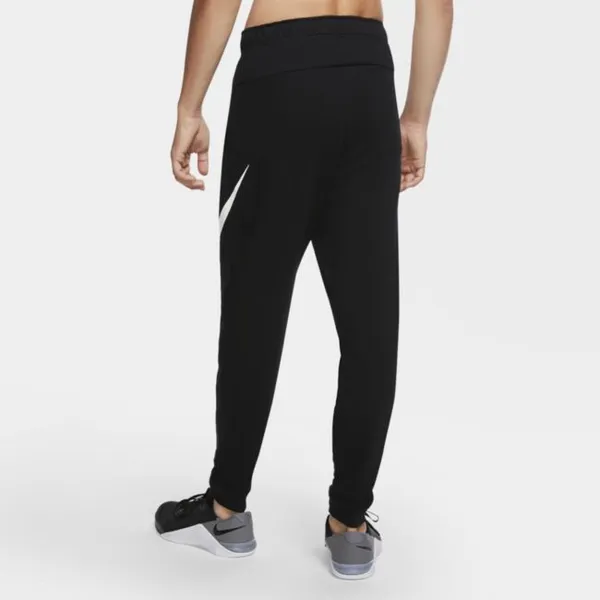 Męskie spodnie treningowe o zwężanym kroju Nike Dri-FIT - Czerń