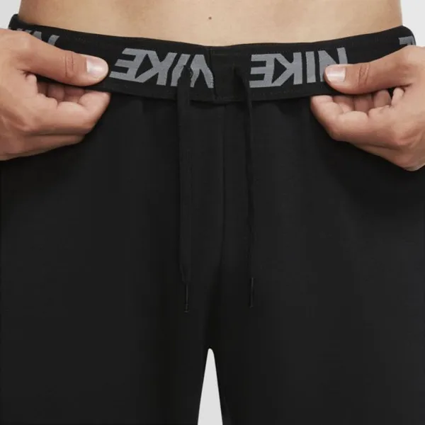 Męskie spodnie treningowe o zwężanym kroju Nike Dri-FIT - Czerń