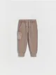 Dresowe spodnie typu jogger, wykonane z bawełnianej dzianiny typu pique. - brązowy