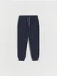Dresowe spodnie typu jogger, wykonane z bawełnianej dzianiny typu pique. - granatowy