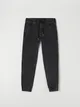 Spodnie jeansowe o kroju jogger, wykonane z tkaniny z dodatkiem elastycznych włókien. - czarny