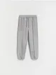 Spodnie typu jogger, wykonane z dresowej dzianiny z bawełną. - jasnoszary